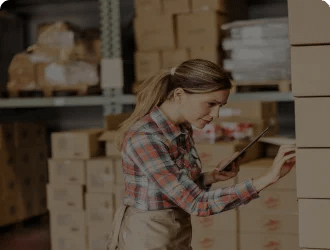 Warehouse worker leveraging Sweaka's solution for instant notifications and real-time updates on warehouse operations.